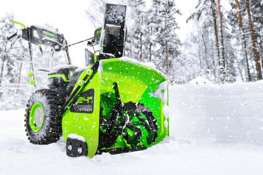 Greenworks snow blower on snowy driveway